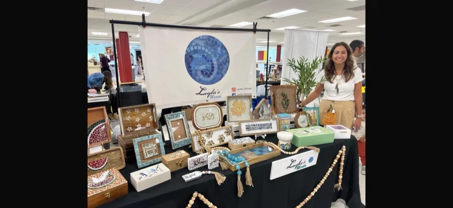 Dania at a local art market with the full Layla's Mosaic collection