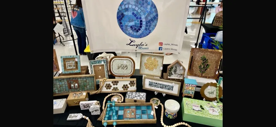 Layla's Mosaic booth display — trays, boxes, calligraphy art, and bead garlands